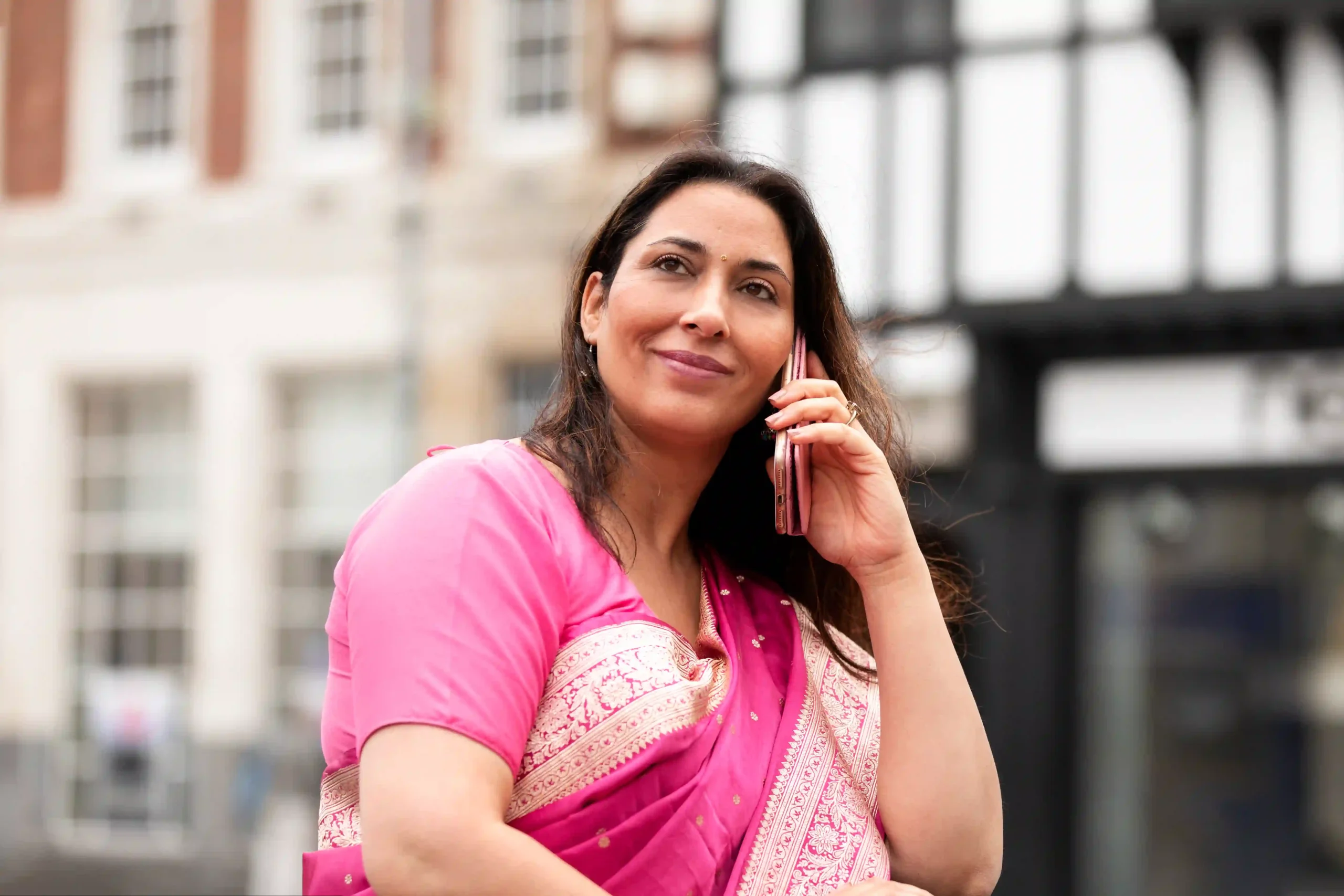 medium shot woman talking phone